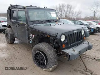 2008 Jeep Wrangler Unlimited X with VIN 1J4GA39138L641138, listed as a IAAI auction lot 41986230 with 215,026 mi miles. Bid and sale history available at carsss.com. Image 1.