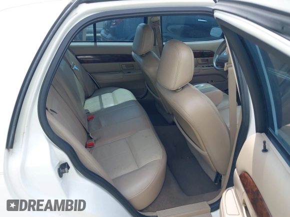 2004 Mercury Grand Marquis GS z VIN 2MEFM74W54X654116, wystawiony jako IAAI lot #41875021 z przebiegiem 129 999 mil mil oraz . Historia ofert i sprzedaży dostępna na DreamBid. Obrazek 8.