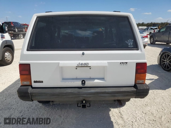 1994 Jeep Cherokee SE with VIN 1J4FT28SXRL151422, listed as a Copart auction lot 77358594 with 74,628 mi miles and Salvage Title. Bid and sale history available at carsss.com. Image 6.