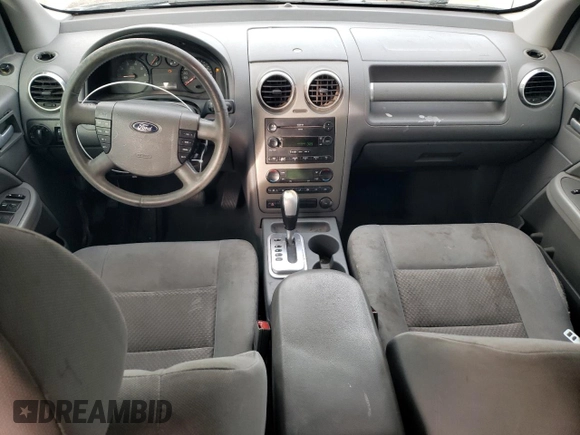 2005 Ford Freestyle SEL z VIN 1FMDK05165GA15433, wystawiony jako Copart lot #87221574 z przebiegiem Nie podano mil oraz Szkoda całkowita • Salvage title. Historia ofert i sprzedaży dostępna na DreamBid. Obrazek 8.