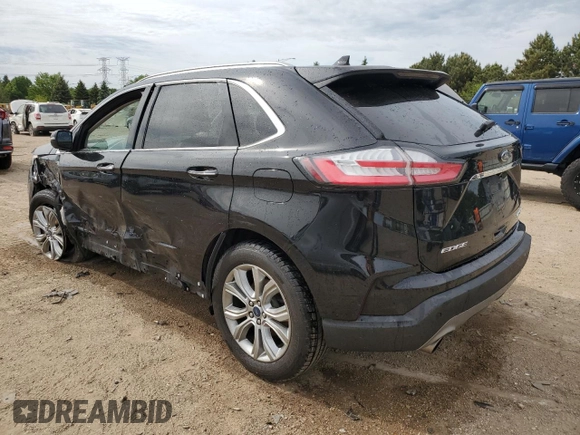 2019 Ford Edge Titanium with VIN 2FMPK4K93KBB42822, listed as a Copart auction lot 57308545 with 102,252 mi miles and Salvage title. Bid and sale history available at DreamBid. Image 2.