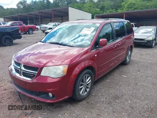 2014 Dodge Grand Caravan SXT with VIN 2C4RDGCG4ER366537, listed as a IAAI auction lot 42148032 with 126,531 mi miles and . Bid and sale history available at DreamBid. Image 2.