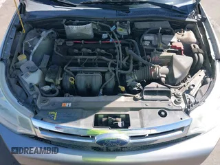 2008 Ford Focus SE with VIN 1FAHP35N68W154490, listed as a IAAI auction lot 42128643 with 141,316 mi miles. Bid and sale history available at carsss.com. Image 10.