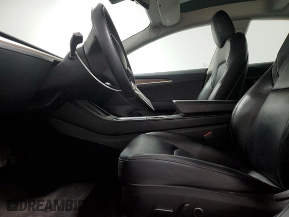 2023 Tesla Model 3 with VIN 5YJ3E1EA6PF455789, listed as a Copart auction lot 54715665 with 64,658 mi miles and Salvage Title. Bid and sale history available at DreamBid. Image 7.