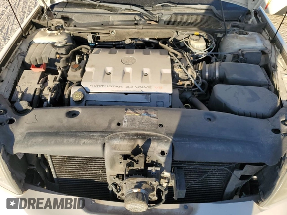 2001 Cadillac DeVille DHS z VIN 1G6KE57Y31U229255, wystawiony jako Copart lot #75101214 z przebiegiem 141 187 mil mil oraz Czysty tytuł • Clean title. Historia ofert i sprzedaży dostępna na DreamBid. Obrazek 11.