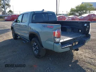 2022 Toyota Tacoma SR with VIN 3TMCZ5AN7NM501028, listed as a IAAI auction lot 42537868 with 42,186 mi miles and . Bid and sale history available at DreamBid. Image 3.