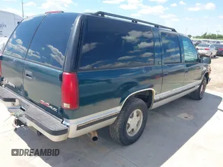 1995 GMC Suburban with VIN 1GKEC16KXSJ712111, listed as a IAAI auction lot 42185423 with 269,010 mi miles and . Bid and sale history available at DreamBid. Image 4.