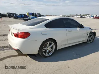 2015 BMW 4 Series 428i xDrive with VIN WBA3N5C5XFK197692, listed as a Copart auction lot 77219684 with 96,148 mi miles and Salvage title. Bid and sale history available at DreamBid. Image 3.