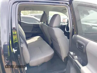 2022 Toyota Tacoma SR with VIN 3TYCZ5AN0NT074683, listed as a IAAI auction lot 42117875 with 51,112 mi miles and . Bid and sale history available at DreamBid. Image 8.
