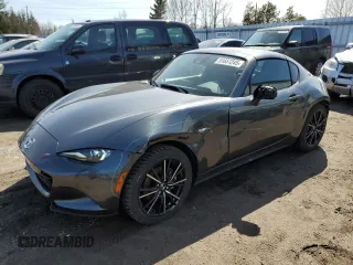 2024 Mazda MX-5 Miata Grand Touring z VIN JM1NDAM71R0603639, wystawiony jako Copart lot #51651245 z przebiegiem 6 899 mil mil oraz Szkoda całkowita • Salvage title. Historia ofert i sprzedaży dostępna na DreamBid. Obrazek 1.