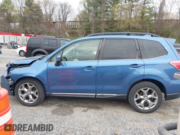 2017 Subaru Forester Touring with VIN JF2SJAWC1HH443799, listed as a IAAI auction lot 41943045 with 122,213 mi miles and . Bid and sale history available at DreamBid. Image 14.