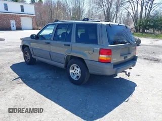1997 Jeep Grand Cherokee Laredo with VIN 1J4GZ58S7VC713517, listed as a IAAI auction lot 42062214 with 205,533 mi miles. Bid and sale history available at carsss.com. Image 3.