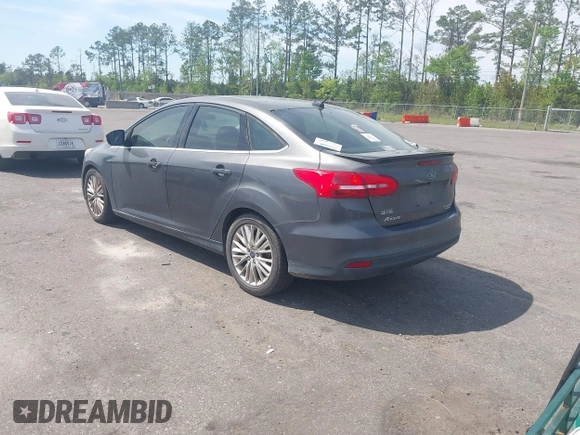 2015 Ford Focus Titanium with VIN 1FADP3J24FL277732, listed as a IAAI auction lot 41903397 with 238,138 mi miles and . Bid and sale history available at carsss.com. Image 3.
