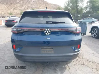 2023 Volkswagen ID.4 Pro z VIN 1V2DNPE8XPC019169, wystawiony jako IAAI lot #41313501 z przebiegiem 32 552 mil mil oraz . Historia ofert i sprzedaży dostępna na DreamBid. Obrazek 17.