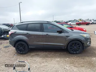 2017 Ford Escape SE with VIN 1FMCU0G99HUC65571, listed as a IAAI auction lot 41923517 with 77,179 mi miles and . Bid and sale history available at DreamBid. Image 13.