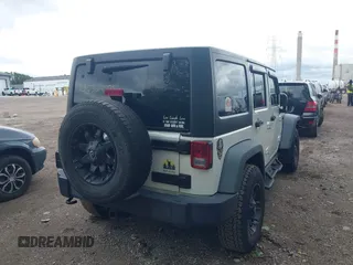2014 Jeep Wrangler Unlimited Sport with VIN 1C4BJWDG9EL135077, listed as a IAAI auction lot 42324775 with 104,221 mi miles and . Bid and sale history available at DreamBid. Image 4.