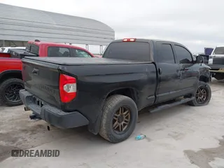 2014 Toyota Tundra 4WD Truck SR with VIN 5TFUM5F14EX051843, listed as a IAAI auction lot 41773983 with 145,089 mi miles. Bid and sale history available at carsss.com. Image 4.