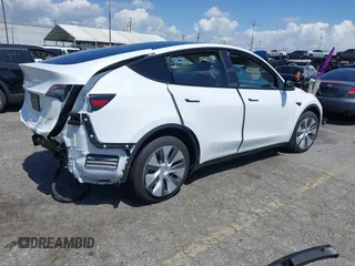 2023 Tesla Model Y Long Range with VIN 7SAYGAEE5PF855834, listed as a IAAI auction lot 41943491 with 34,480 mi miles. Bid and sale history available at carsss.com. Image 4.