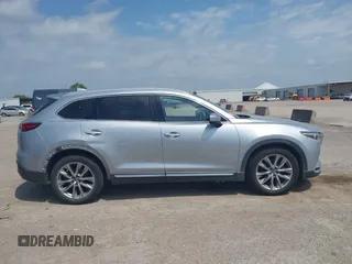 2016 Mazda CX-9 Signature with VIN JM3TCBEY9G0117785, listed as a IAAI auction lot 42331883 with 115,096 mi miles and . Bid and sale history available at DreamBid. Image 13.