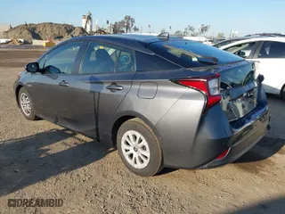 2020 Toyota Prius L Eco with VIN JTDKARFUXL3117737, listed as a IAAI auction lot 41988550 with 64,865 mi miles. Bid and sale history available at carsss.com. Image 3.