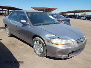 2000 Honda Accord LX z VIN 1HGCG1645YA021815, wystawiony jako IAAI lot #42438876 z przebiegiem 219 687 mil mil oraz . Historia ofert i sprzedaży dostępna na DreamBid. Obrazek 1.