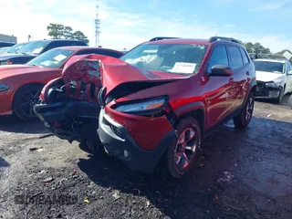 2014 Jeep Cherokee Trailhawk with VIN 1C4PJMBS0EW257133, listed as a IAAI auction lot 41446095 with 82,285 mi miles and . Bid and sale history available at DreamBid. Image 2.