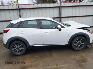 2016 Mazda CX-3 Grand Touring with VIN JM1DKBD73G0124742, listed as a IAAI auction lot 41448684 with 96,322 mi miles. Bid and sale history available at carsss.com. Image 13.