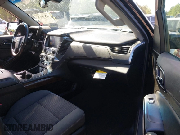 2019 Chevrolet Suburban LS with VIN 1GNSKGKC2KR353977, listed as a IAAI auction lot 42129814 with 85,454 mi miles and . Bid and sale history available at DreamBid. Image 5.