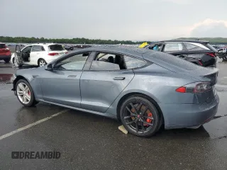 2014 Tesla Model S 60 with VIN 5YJSA1H14EFP28471, listed as a Copart auction lot 64928534 with 99,442 mi miles and Clean Title. Bid and sale history available at DreamBid. Image 2.