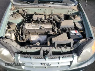 2003 Hyundai Accent GL with VIN KMHCG35CX3U242848, listed as a Copart auction lot 86558394 with 56,248 mi miles and Salvage Title. Bid and sale history available at carsss.com. Image 11.