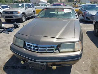 1987 Ford Thunderbird z VIN 1FABP6033HH213366, wystawiony jako IAAI lot #42368900 z przebiegiem Nie podano mil oraz . Historia ofert i sprzedaży dostępna na DreamBid. Obrazek 6.