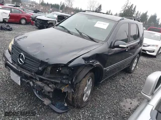 2002 Mercedes-Benz M-Class with VIN 4JGAB54E72A296354, listed as a IAAI auction lot 41277897 with 101,842 mi miles. Bid and sale history available at carsss.com. Image 2.