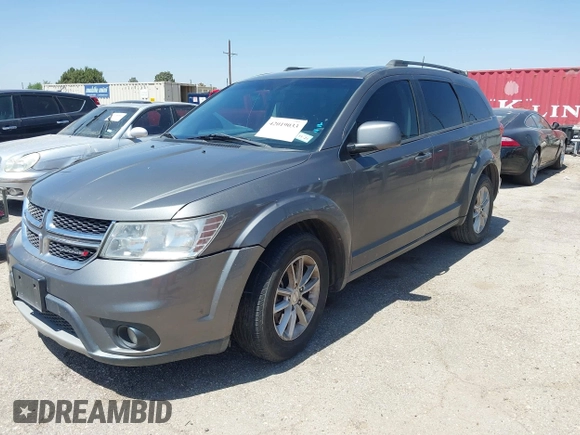 2013 Dodge Journey SXT with VIN 3C4PDCBB4DT563709, listed as a IAAI auction lot 42019033 with 201,188 mi miles. Bid and sale history available at carsss.com. Image 2.