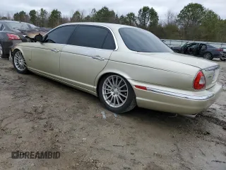 2006 Jaguar XJ with VIN SAJWA79B76SH08803, listed as a Copart auction lot 40268774 with 0 mi miles and Salvage Title. Bid and sale history available at carsss.com. Image 2.