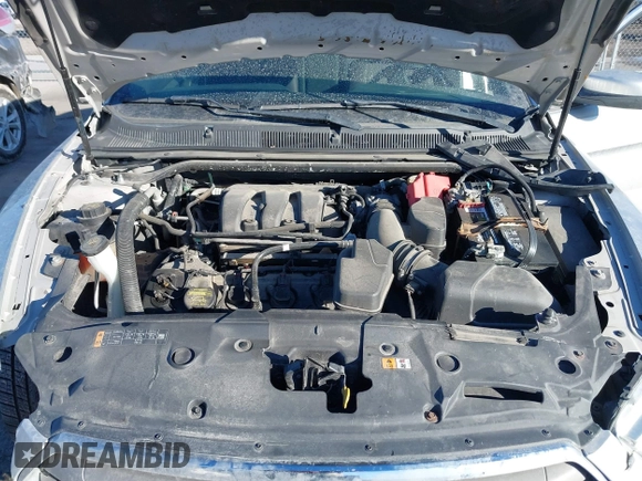 2013 Ford Taurus SEL with VIN 1FAHP2E83DG224780, listed as a IAAI auction lot 41675601 with 166,977 mi miles. Bid and sale history available at carsss.com. Image 10.