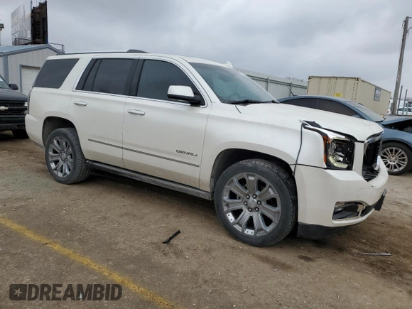 2015 GMC Yukon Denali with VIN 1GKS1CKJ1FR619793, listed as a Copart auction lot 86910314 with 128,559 mi miles and Salvage Title. Bid and sale history available at carsss.com. Image 4.