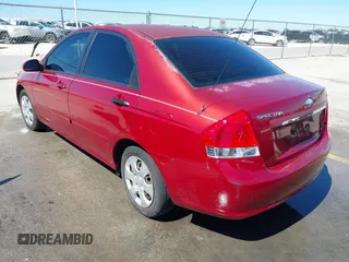 2009 Kia Spectra EX with VIN KNAFE221195606045, listed as a IAAI auction lot 41764519 with 124,577 mi miles. Bid and sale history available at carsss.com. Image 3.