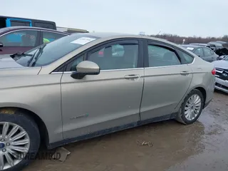 2015 Ford Fusion S Hybrid with VIN 3FA6P0UU4FR111409, listed as a IAAI auction lot 41447316 with 150,068 mi miles. Bid and sale history available at carsss.com. Image 14.