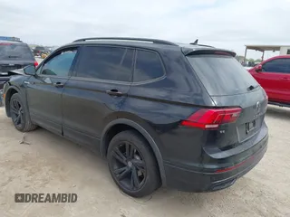 2023 Volkswagen Tiguan SE R-Line Black with VIN 3VVCB7AX0PM122636, listed as a IAAI auction lot 42040494 with 8,589 mi miles and . Bid and sale history available at DreamBid. Image 3.