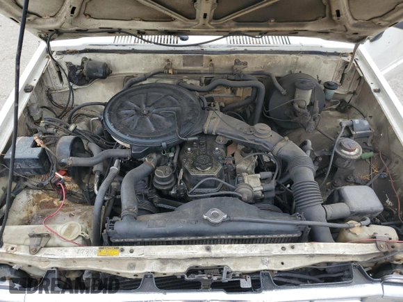 1988 Toyota Pickup z VIN JT4RN50R0J5122639, wystawiony jako Copart lot #52792445 z przebiegiem 233 407 mil mil oraz Szkody całkowita. Historia ofert i sprzedaży dostępna na DreamBid. Obrazek 11.