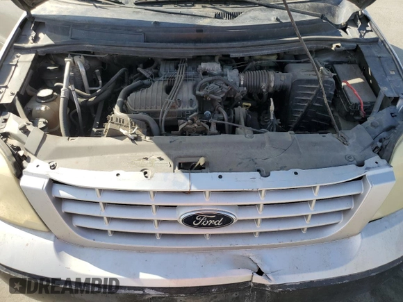 2006 Ford Freestar Cargo z VIN 2FTZA54676BA54418, wystawiony jako Copart lot #77353384 z przebiegiem Nie podano mil oraz Szkoda całkowita • Salvage title. Historia ofert i sprzedaży dostępna na DreamBid. Obrazek 12.