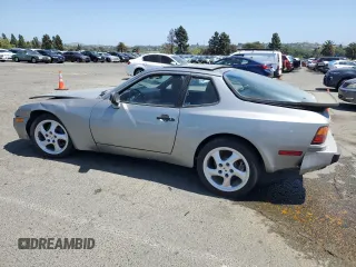 1986 Porsche 944 z VIN WP0AA0946GN459926, wystawiony jako Copart lot #52357845 z przebiegiem 89 937 mil mil oraz Szkoda całkowita • Salvage title. Historia ofert i sprzedaży dostępna na DreamBid. Obrazek 2.