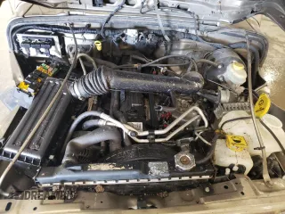 2004 Jeep Wrangler Rubicon z VIN 1J4FA69S44P784141, wystawiony jako Copart lot #55235305 z przebiegiem 125 564 mil mil oraz Szkoda całkowita • Salvage title. Historia ofert i sprzedaży dostępna na DreamBid. Obrazek 12.