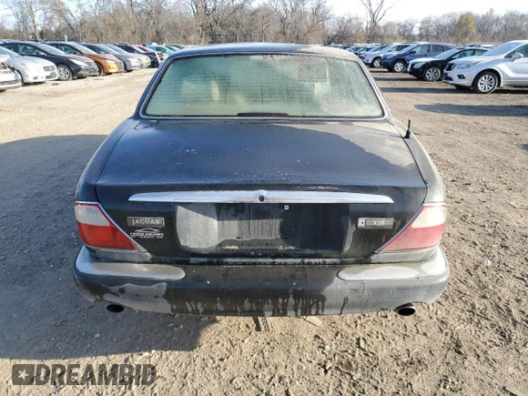 1998 Jaguar XJ with VIN SAJHX1245WC819762, listed as a Copart auction lot 81480174 with 132,491 mi miles and Salvage title. Bid and sale history available at DreamBid. Image 6.