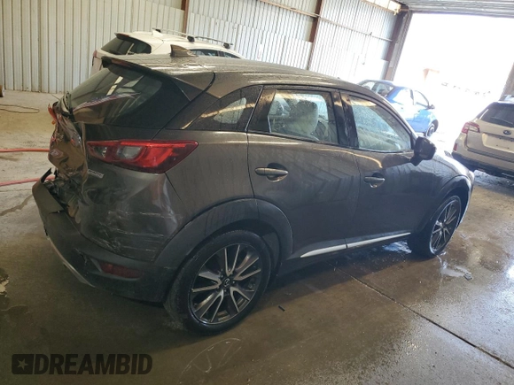 2016 Mazda CX-3 Grand Touring z VIN JM1DKFD74G0137815, wystawiony jako Copart lot #52405765 z przebiegiem 128 922 mil mil oraz Szkoda całkowita • Salvage title. Historia ofert i sprzedaży dostępna na DreamBid. Obrazek 3.