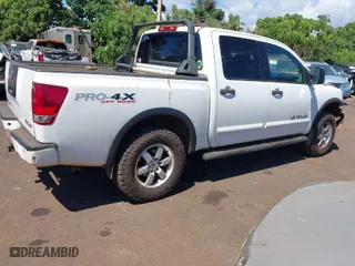 2010 Nissan Titan SE with VIN 1N6AA0EC1AN306419, listed as a IAAI auction lot 41658404 with 114,770 mi miles. Bid and sale history available at carsss.com. Image 4.