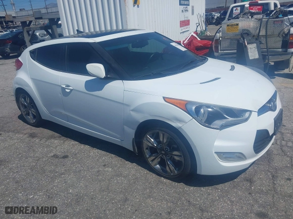 2015 Hyundai Veloster with VIN KMHTC6AD5FU231224, listed as a IAAI auction lot 41944186 with 103,124 mi miles. Bid and sale history available at carsss.com. Image 1.