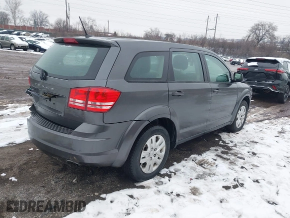 2014 Dodge Journey SE with VIN 3C4PDCAB0ET182376, listed as a IAAI auction lot 41569006 with 106,024 mi miles and . Bid and sale history available at DreamBid. Image 4.