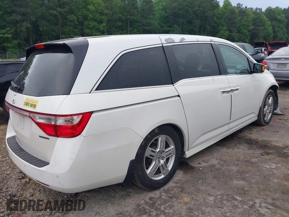2012 Honda Odyssey Touring with VIN 5FNRL5H93CB034485, listed as a IAAI auction lot 42304502 with 198,589 mi miles and . Bid and sale history available at DreamBid. Image 4.