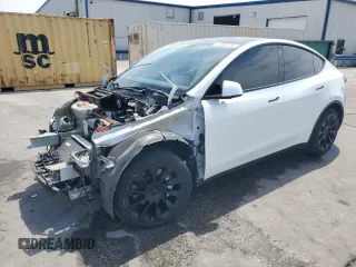 2021 Tesla Model Y Long Range z VIN 5YJYGDEE7MF190090, wystawiony jako Copart lot #53857065 z przebiegiem 64 185 mil mil oraz Nie do naprawy • Non repairable. Historia ofert i sprzedaży dostępna na DreamBid. Obrazek 1.